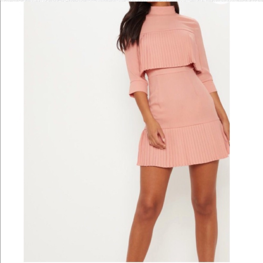 Pink mini dress with pleats.